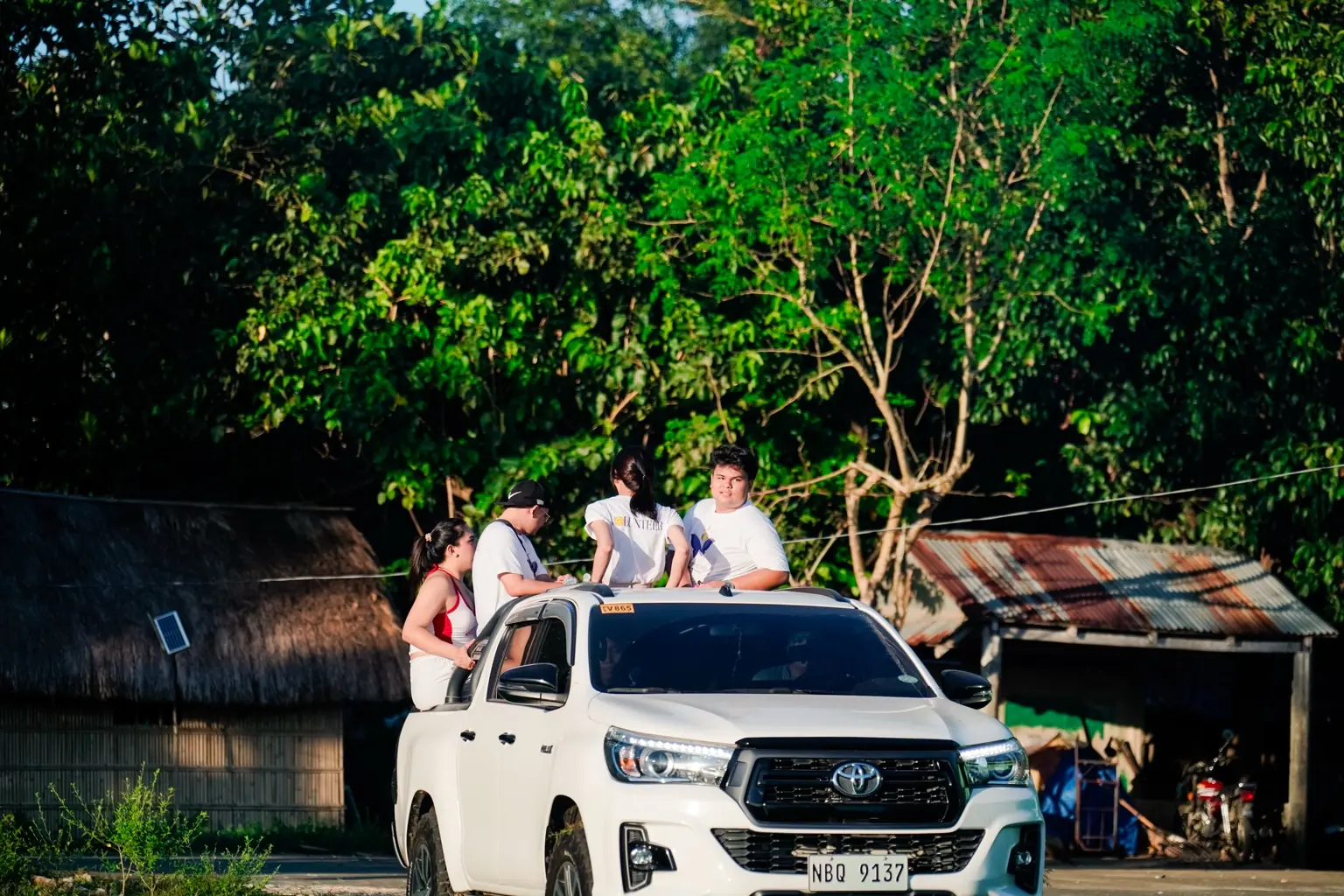 People and vehicles at a community activity